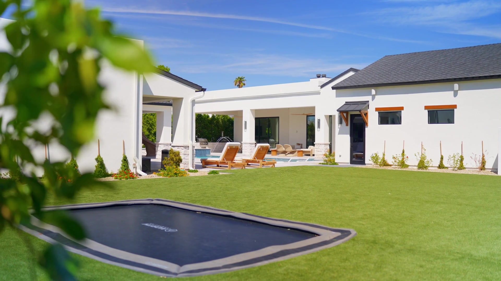 6235 E Aster Dr, rear lawn and pool, built by Bel Aire