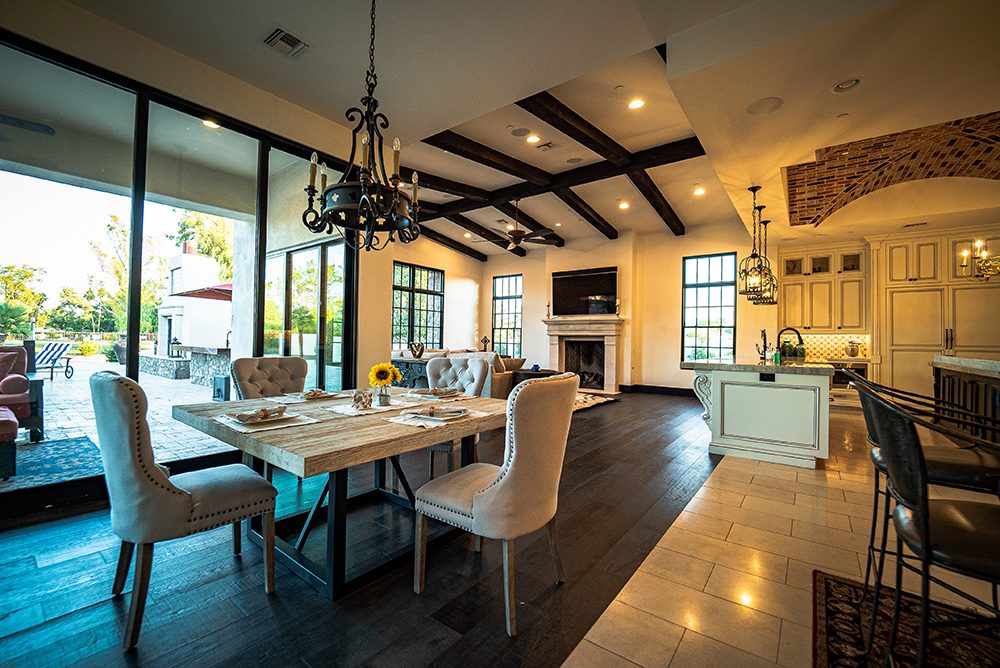 Dining under beams, built by Bel Aire