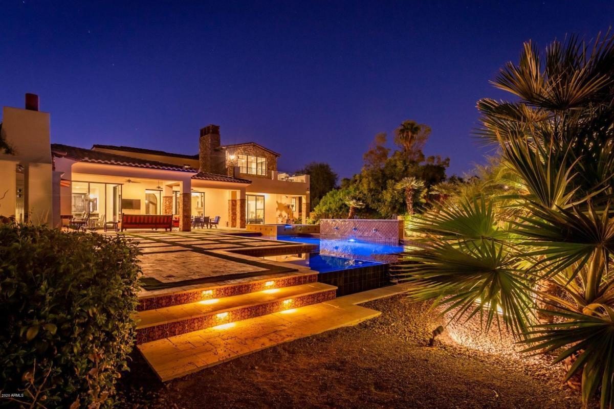 Lit steps and pool at twilight