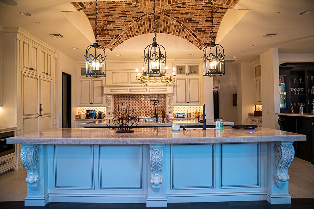 Kitchen with blue island, built by Bel Aire