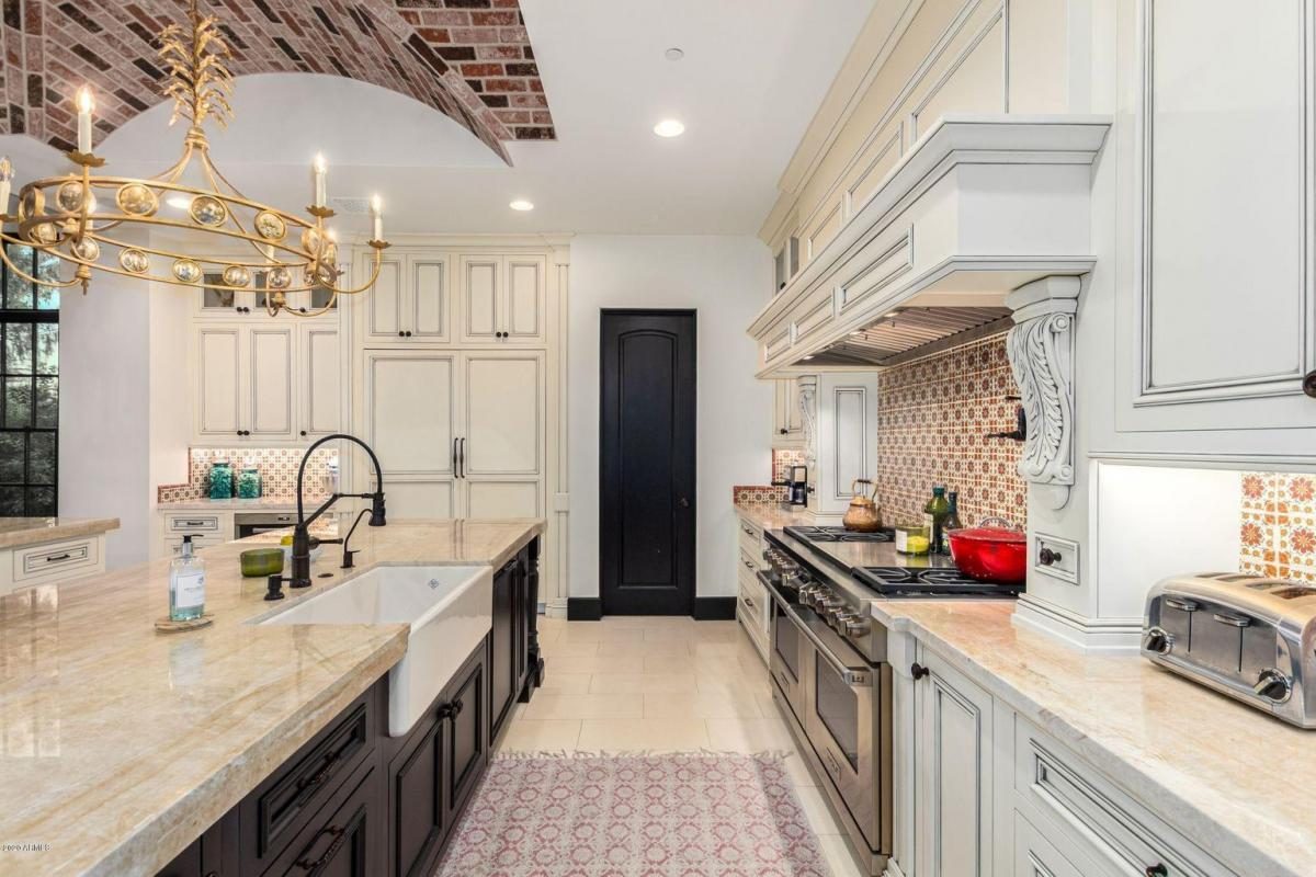 Kitchen under a vaulted brick ceiling
