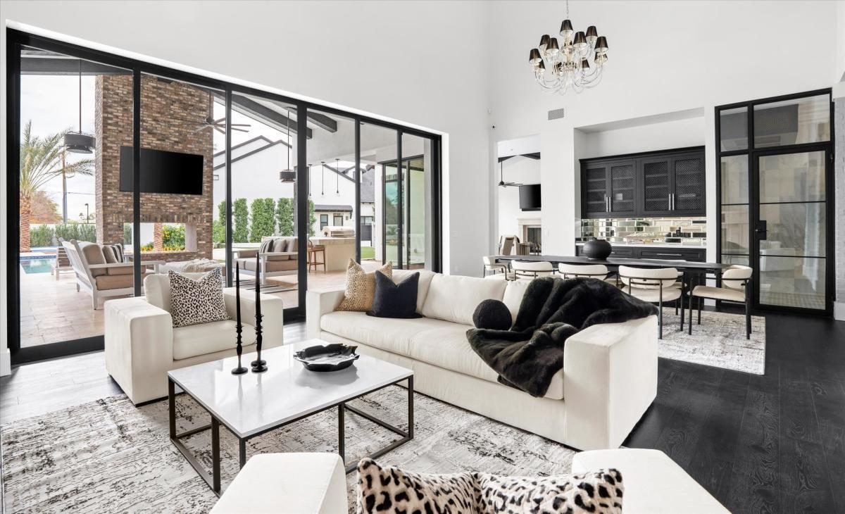 Black and white great room with steel windows