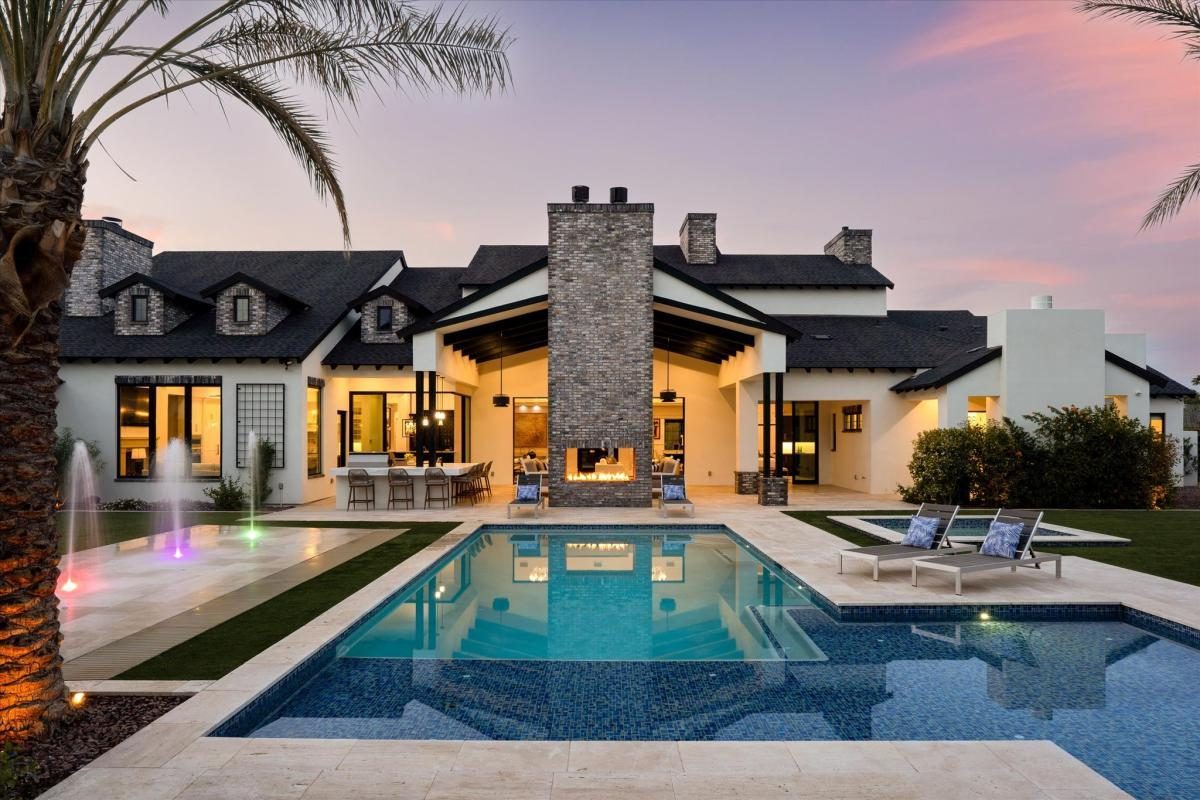 Modern farmhouse pool at dusk