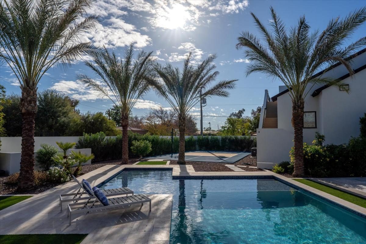 Pool lined with palms, built by Bel Aire